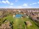 Stunning aerial view of a neighborhood park featuring tennis courts and green spaces at 5185 N Meade Street St, Denver, CO 80221
