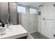Beautiful bathroom featuring a modern vanity with white countertop and a glass-enclosed shower at 5185 N Meade Street St, Denver, CO 80221