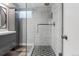 Modern bathroom showcasing a spacious glass-enclosed shower and sleek vanity with updated fixtures at 5185 N Meade Street St, Denver, CO 80221