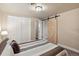 Basement bedroom view featuring a barn door closet, and a traditional closet at 5185 N Meade Street St, Denver, CO 80221