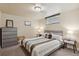 Basement bedroom featuring neutral color scheme, full sized bed, dresser, and nightstands at 5185 N Meade Street St, Denver, CO 80221