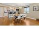 The bright dining area features hardwood floors and flows into the kitchen at 5185 N Meade Street St, Denver, CO 80221