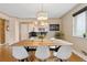 The dining room features hardwood floors, modern lighting, and adjoins the open-concept kitchen at 5185 N Meade Street St, Denver, CO 80221