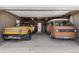 Spacious two-car garage featuring a yellow Rivian and an orange VW Bus at 5185 N Meade Street St, Denver, CO 80221