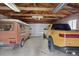 Spacious garage featuring an overhead door and enough room for two vehicles and exposed wood rafters at 5185 N Meade Street St, Denver, CO 80221