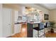 Stylish kitchen with bar seating open to dining area and stainless steel appliances at 5185 N Meade Street St, Denver, CO 80221