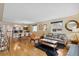 Bright living room flows to dining area with hardwood floors and large windows at 5185 N Meade Street St, Denver, CO 80221