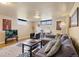 Cozy living room featuring modern furniture, an area rug, and great natural light from the window at 5185 N Meade Street St, Denver, CO 80221