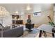 Basement living room with open layout that features a kitchenette, living area, and work space at 5185 N Meade Street St, Denver, CO 80221