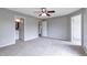 Bedroom featuring neutral walls, carpeted floor, and ensuite bathroom at 1365 Waxwing Ave, Brighton, CO 80601