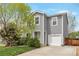 Charming two-story home featuring gray siding, well-kept landscaping, and an attached one car garage at 1365 Waxwing Ave, Brighton, CO 80601