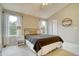 Bright bedroom featuring neutral walls, ceiling fan and two windows with natural light at 517 Sylvestor Trl, Highlands Ranch, CO 80129