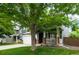 Charming two-story home with a two-car garage and covered front porch with mature trees at 517 Sylvestor Trl, Highlands Ranch, CO 80129
