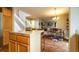 Open kitchen featuring an island with granite countertops and hardwood floors at 517 Sylvestor Trl, Highlands Ranch, CO 80129