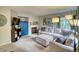 Cozy living room featuring a fireplace, plush sofa, and bright blue cabinet at 517 Sylvestor Trl, Highlands Ranch, CO 80129