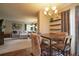 Open-concept living space with dining area, and adjacent sitting room at 517 Sylvestor Trl, Highlands Ranch, CO 80129