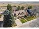Aerial view of a beautiful suburban home with mature trees and expansive natural surroundings at 5106 S Kenton Way, Greenwood Village, CO 80111
