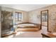 Bathroom showcasing marble shower, soaking tub, and floral wallpaper at 5106 S Kenton Way, Greenwood Village, CO 80111
