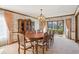 Classic dining room showcasing wallpaper, a large china cabinet and furniture at 5106 S Kenton Way, Greenwood Village, CO 80111
