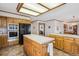 Functional kitchen with an island, and ample cabinet space, with modern appliances at 5106 S Kenton Way, Greenwood Village, CO 80111