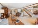 Cozy living room featuring wood trim, piano, vintage furniture and a staircase at 5106 S Kenton Way, Greenwood Village, CO 80111