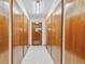 Hallway of storage closets with neutral paint and tile flooring at 775 S Alton Way # 3C, Denver, CO 80247