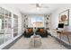 Living area with built-in shelving, comfortable seating, and a dedicated workspace at 775 S Alton Way # 3C, Denver, CO 80247