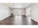 Spacious living room with hardwood floors and sliding glass doors to a private balcony at 775 S Alton Way # 3C, Denver, CO 80247
