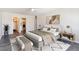 Relaxing main bedroom with large bed and en-suite bathroom featuring a walk-in closet at 775 S Alton Way # 3C, Denver, CO 80247