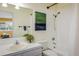 Bathroom with a shower and tub combo, and a vanity with a sink and view into main bedroom at 2976 Eagle Way, Boulder, CO 80301