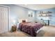 Bedroom with light blue paint, carpet, and a window plus a workspace with a desk at 2976 Eagle Way, Boulder, CO 80301