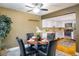 Dining room features a glass table, hardwood floors, and a view into the modern kitchen at 2976 Eagle Way, Boulder, CO 80301