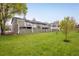 View of the homes with a large green lawn and wood fences at 2976 Eagle Way, Boulder, CO 80301
