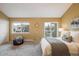 Main bedroom with carpet, a window, and a sliding door to an outdoor deck at 2976 Eagle Way, Boulder, CO 80301
