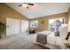 Main bedroom with carpet, a window, a sliding door to an outdoor deck, and ample closet space at 2976 Eagle Way, Boulder, CO 80301