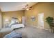 Spacious main bedroom with high ceilings, neutral paint colors, carpet, and ensuite bathroom at 2976 Eagle Way, Boulder, CO 80301