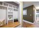 Mud room featuring built-in shelving, hooks, and a wood bench with an adjacent hallway at 2976 Eagle Way, Boulder, CO 80301