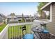 Outdoor deck featuring a table and chairs, perfect for enjoying community views of green space at 2976 Eagle Way, Boulder, CO 80301