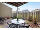 Charming covered patio with brick flooring and outdoor seating, ideal for relaxation at 2976 Eagle Way, Boulder, CO 80301