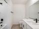 Bathroom featuring a tub with shower, toilet, vanity with sink, and a large mirror at 2237 Garden Ave, Brighton, CO 80601