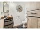 This bathroom features a barrel-style sink and rustic, modern finishes and fixtures at 11462 Iola St, Commerce City, CO 80640
