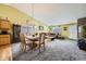 Spacious living room with a dining area, carpet, and neutral color palette at 11462 Iola St, Commerce City, CO 80640