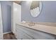 Modern bathroom featuring an updated vanity, decorative mirror, new fixtures and extra storage at 3300 W Florida Ave # 36, Denver, CO 80219