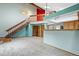 Bright living room with a loft area, and staircase, which provides plenty of natural light at 3300 W Florida Ave # 36, Denver, CO 80219