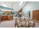 Cozy living room with a brick fireplace and a dining area that offers comfortable seating for Gathering and guests at 3300 W Florida Ave # 36, Denver, CO 80219
