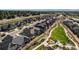 Aerial view of a new development featuring manicured landscaping, sidewalks, and a playground at 811 W 128Th Pl, Westminster, CO 80234