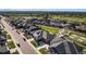 Wide aerial view of a vibrant residential community with modern homes, green spaces, and a park at 811 W 128Th Pl, Westminster, CO 80234