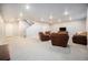 Spacious finished basement featuring neutral carpet, recessed lighting, and comfortable leather seating area at 811 W 128Th Pl, Westminster, CO 80234