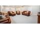Large, finished basement featuring neutral carpet, recessed lighting, and comfortable leather seating area at 811 W 128Th Pl, Westminster, CO 80234