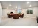 Spacious finished basement featuring neutral carpet, recessed lighting, and comfortable leather seating area at 811 W 128Th Pl, Westminster, CO 80234